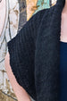 Detail of black alpaca knit long sleeveless cardigan vest for women by Jessica Rose