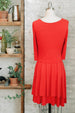 Café coral orange pleated french style dress with 3/4 sleeves and scoop neck in knee length back