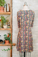 Citrus paisley Liberty print dress in jersey for women. Knee length with scoop neck back view