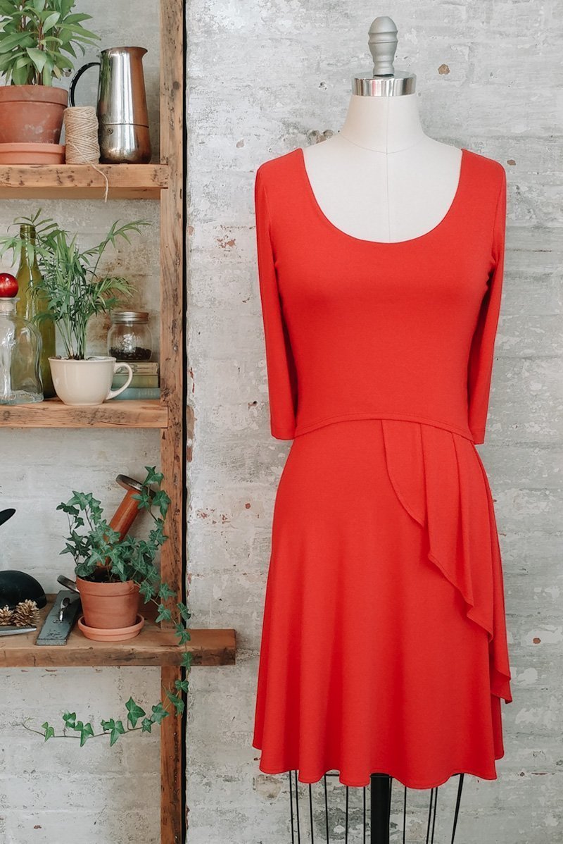 Café coral red orange pleated french style dresses with 3/4 sleeves and scoop neck in knee length
