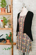 Black open front swing cardigan with lace back over liberty print dress