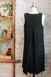 Sleeveless black a-line dress with pockets and boat neck in Triacetate - back pleat