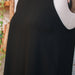 Sleeveless black a-line dress with pockets and boat neck - french darts detail