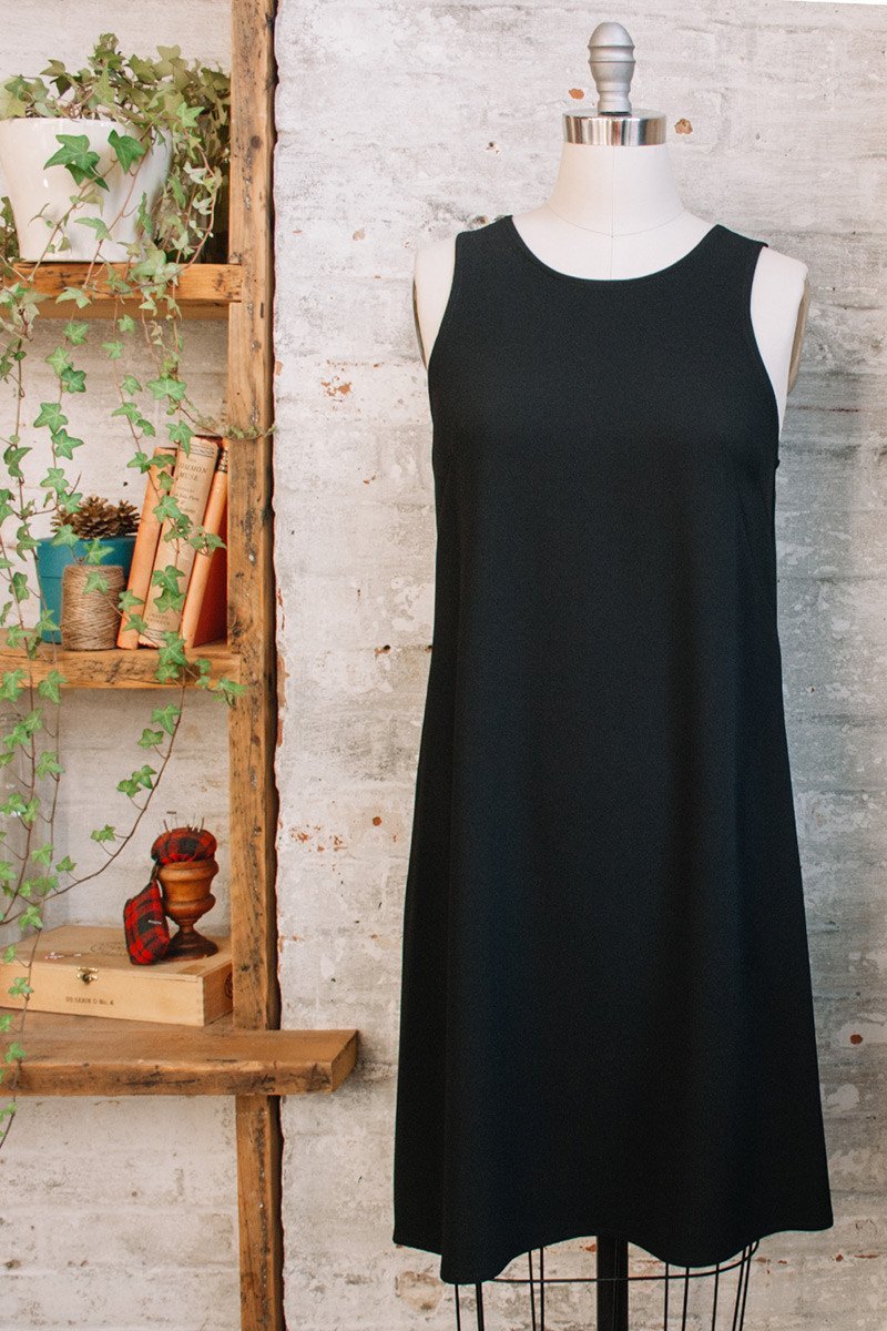 Sleeveless black a-line dress with pockets and boat neck in Triacetate